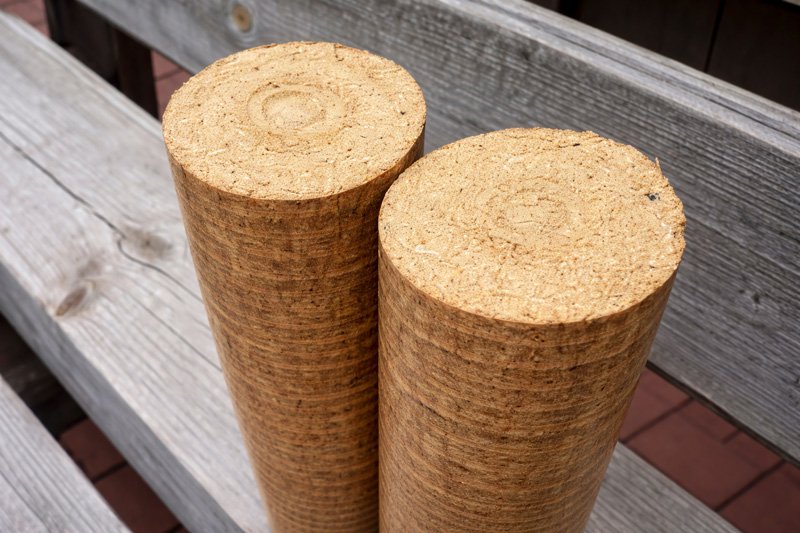Wood-briquettes-on-weathered-bench